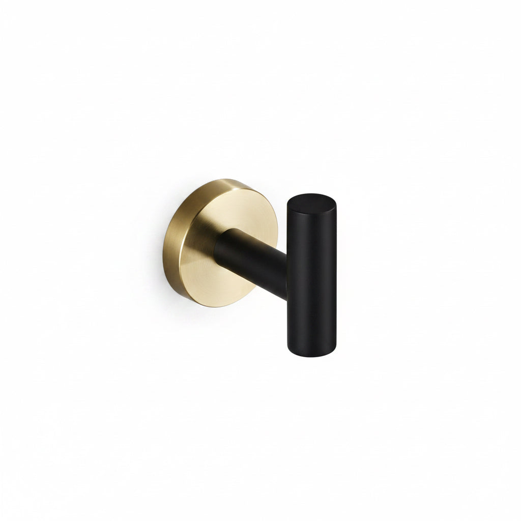 Gold and black wall hook on a white background
